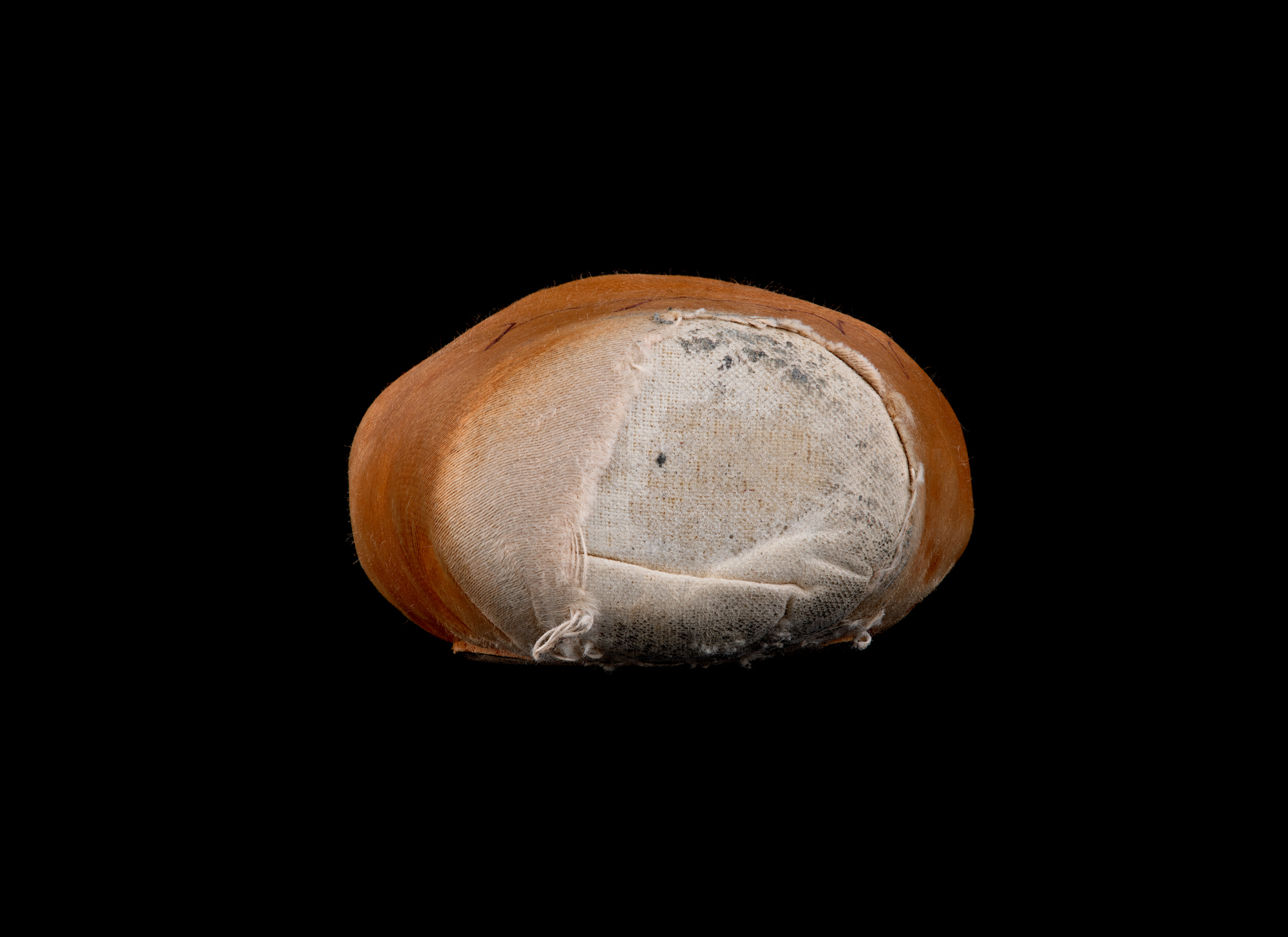 Close-up of the tattered toe of a worn pink pointe shoe