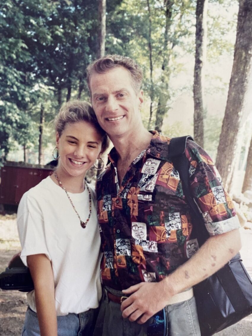 Couple smiling in the woods