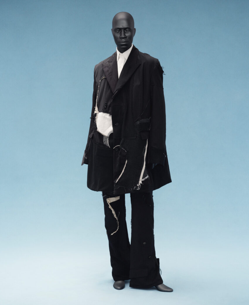 Deconstructed suit by Who Decides War modeled on a Black mannequin at the Met’s Superfine exhibit