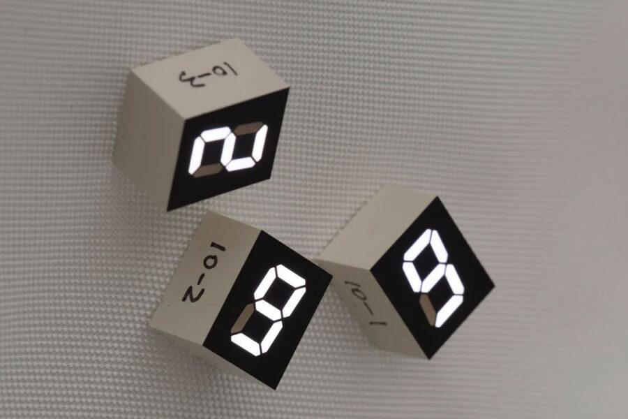 Digital blocks depicting the numbers two, nine, and nine in an art installation by Tatsuo Miyajima