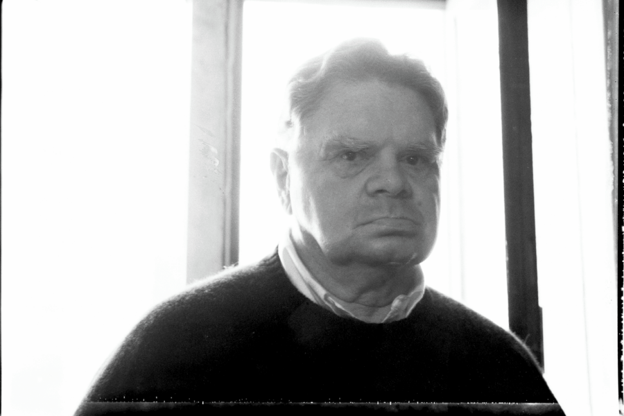 Black-and-white photo of James Schuyler in the hallway of the Chelsea Hotel, New York City, 1988