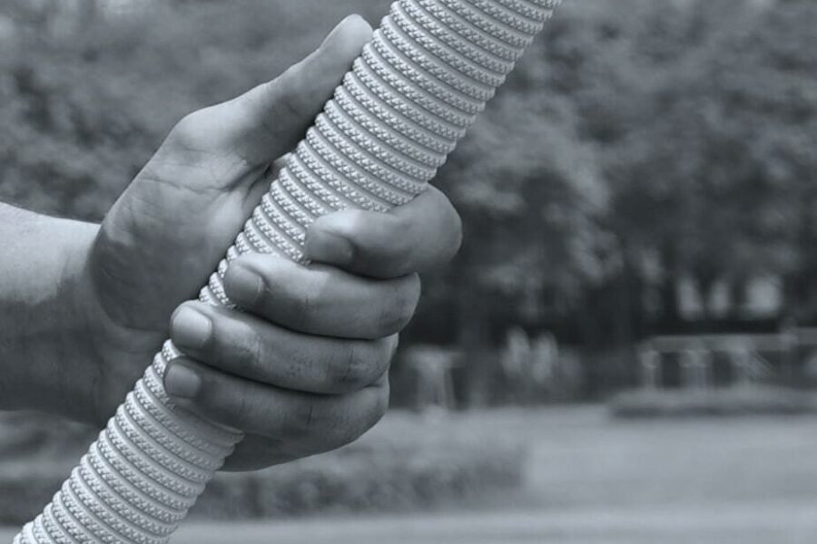hand holding a cricket mallet.  Photo: Yogendra Singh.