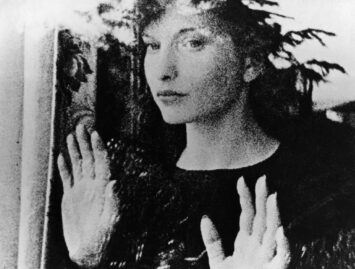 Still from Meshes of the Afternoon, 1943. Woman looks out of a window.