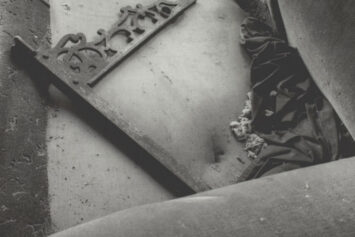 Dick Rudisill’s “Ruined Couch,” a gelatin silver print of a cushionless, dirt-covered sofa