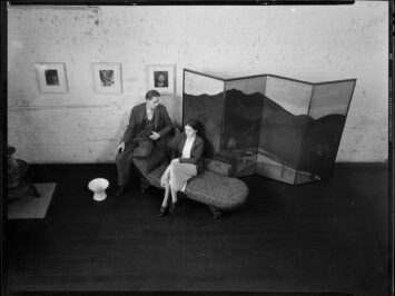 An older photo of two people sitting together