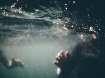 People underwater in a pool